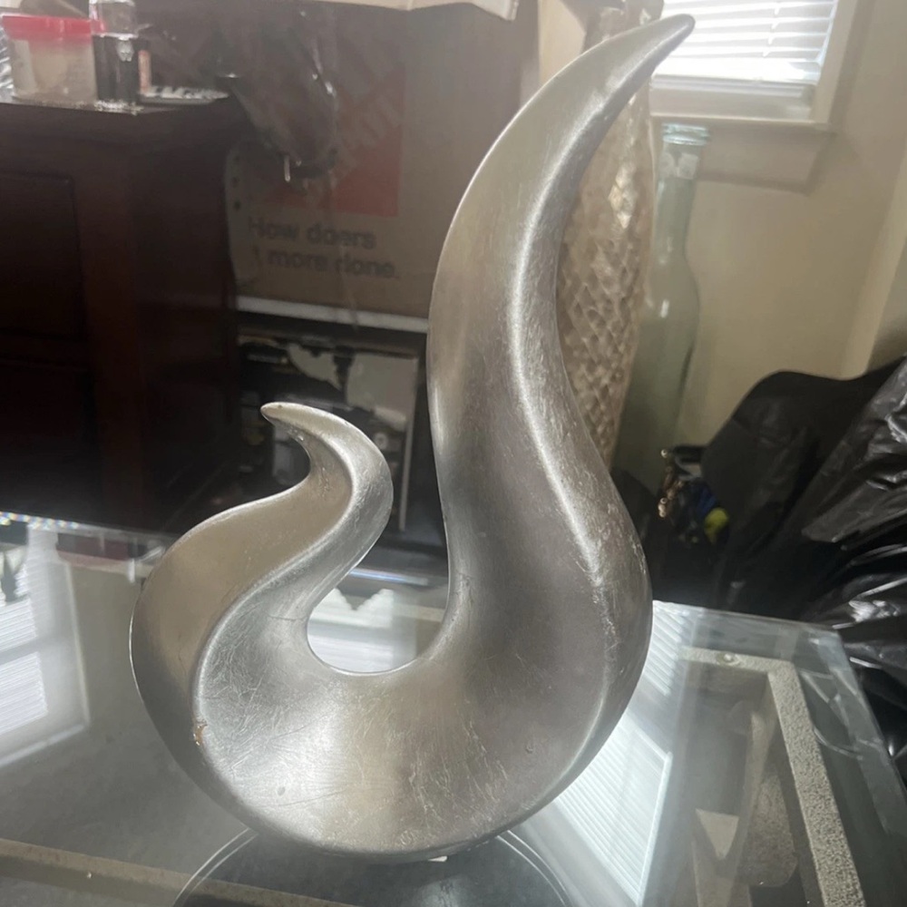 Elegant Silver S-Shaped Sculpture with Fluid Design